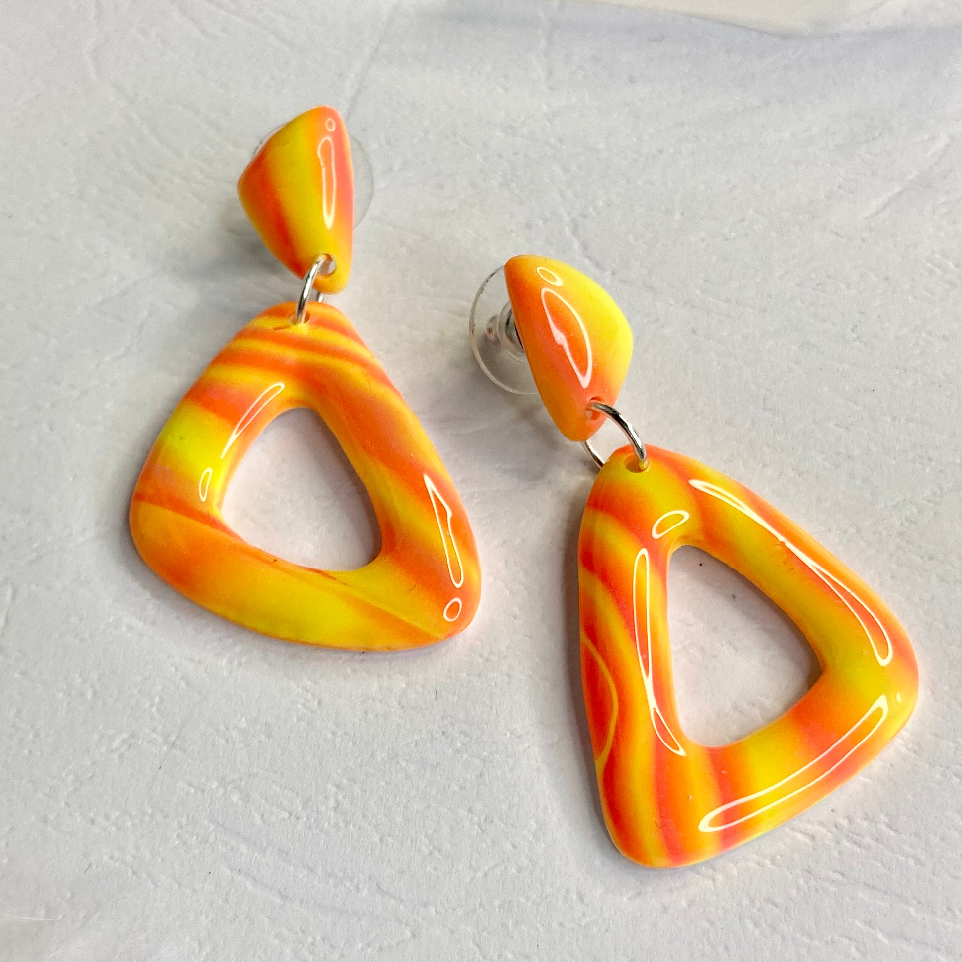 medium triangle earrings neon orange
