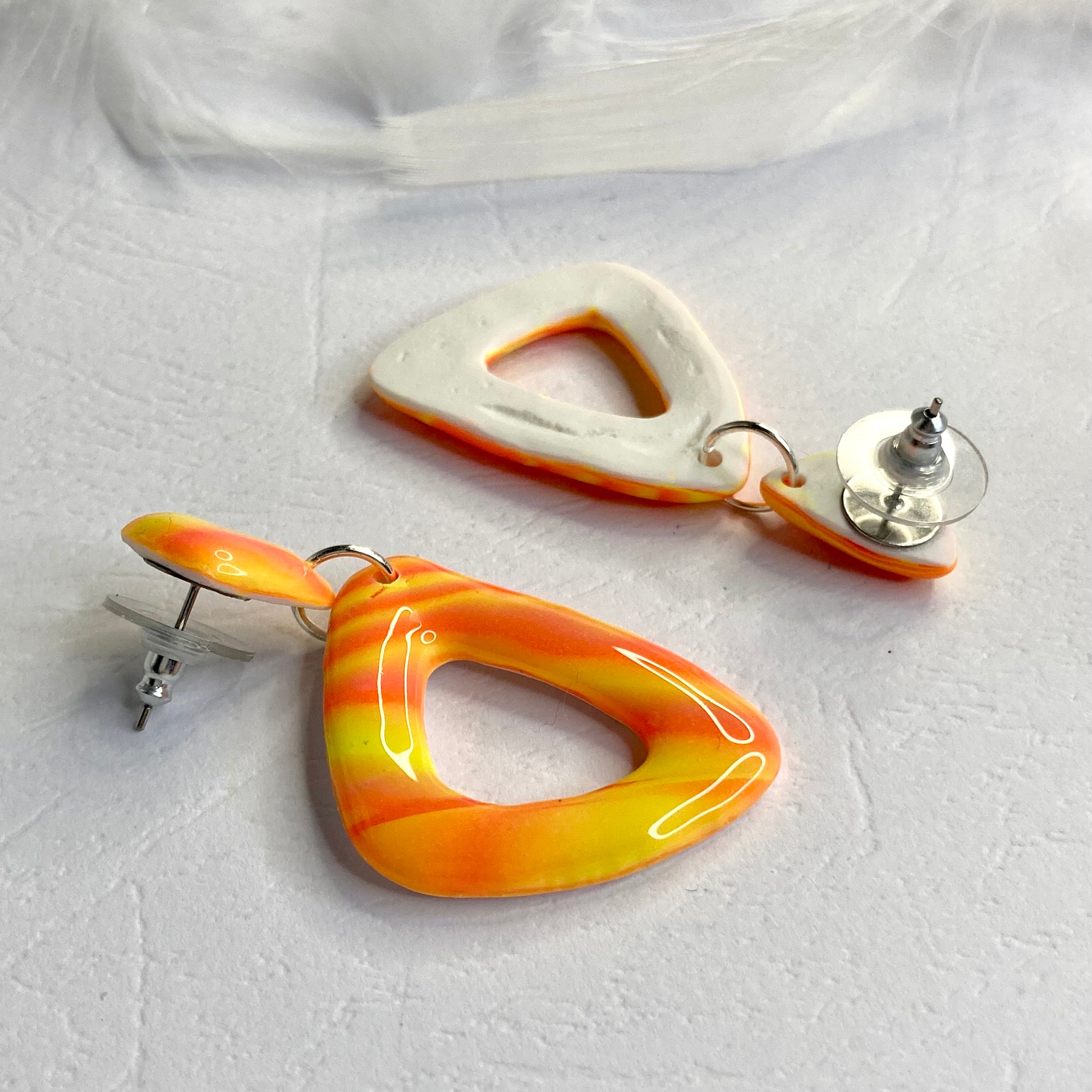 medium triangle earrings neon orange