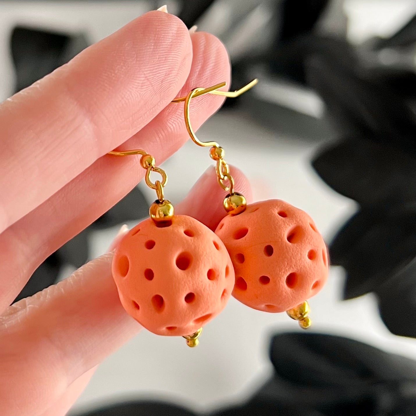 Peach coral balls medium drop earrings  closeup