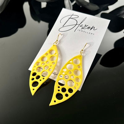 Large dangle earrings Swiss cheese yellow