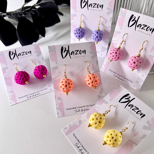 different coloured medium drop earrings coral balls